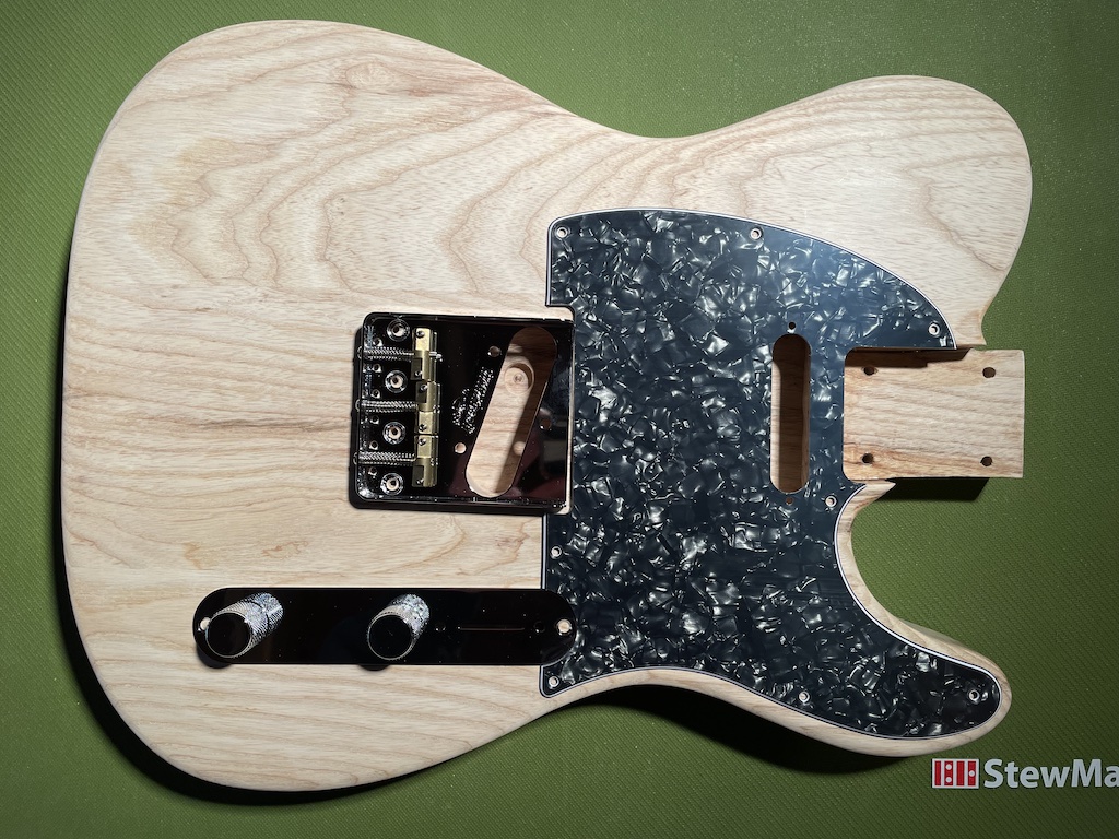 guitar body with components laid out