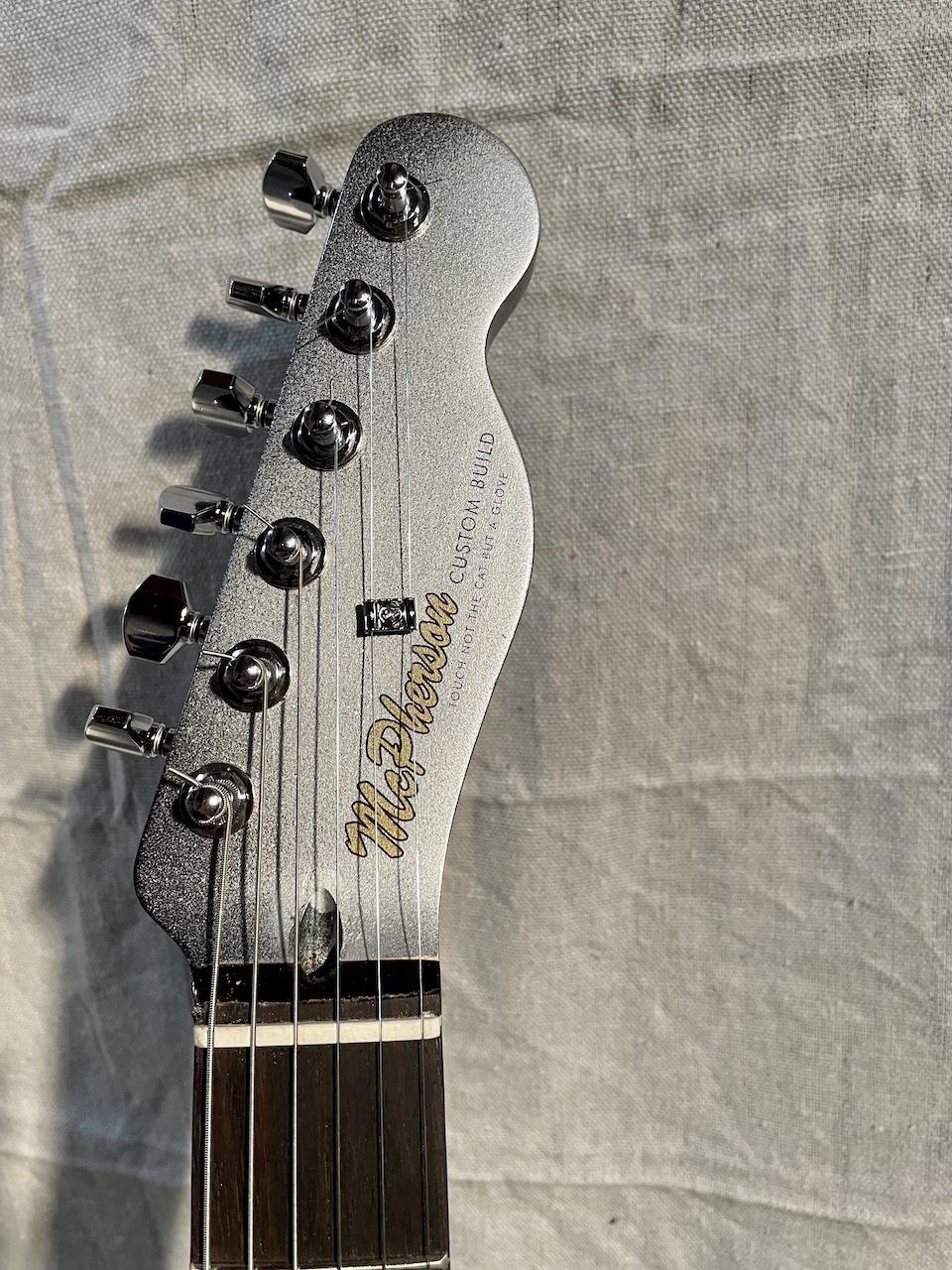 headstock of finished guitar
