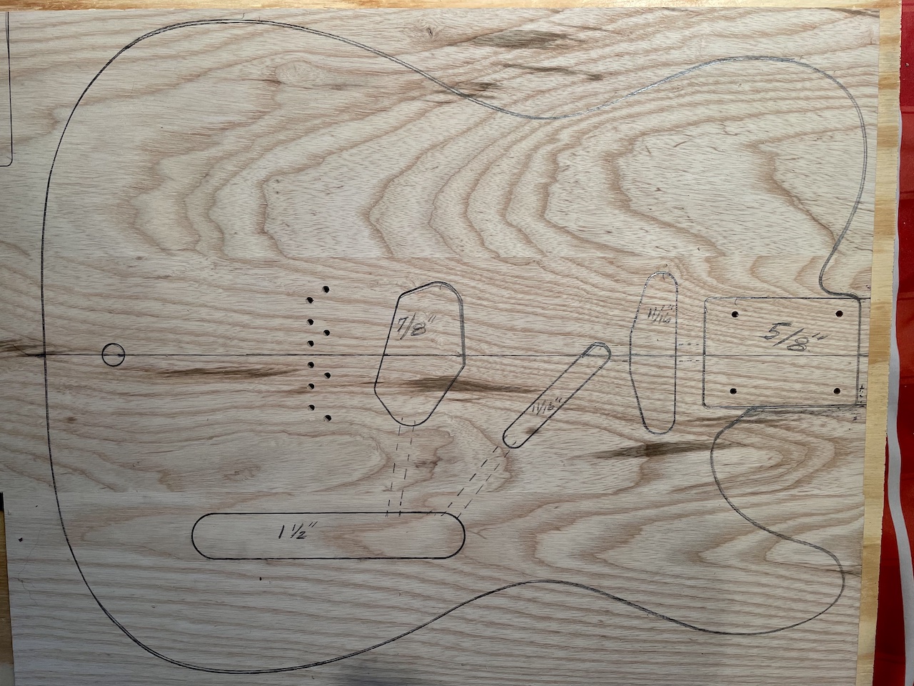 cutting routes marked on wood slab